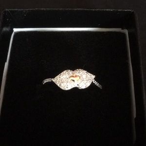 Genuine Diamond ring. Lips. Marked 925 and KRN.